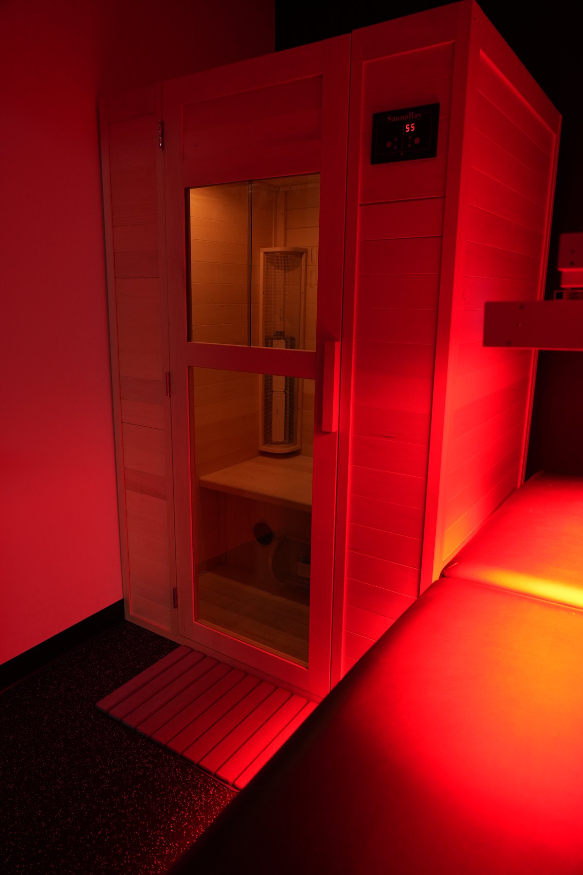 Infrared sauna interior at PRT East York with warm red light glow